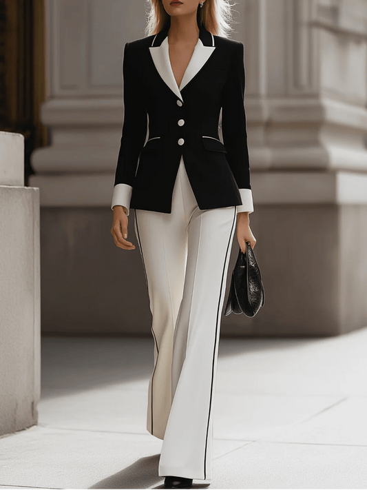Sophisticated Black And White Suit Ensemble for Fall And Winter, Featuring a Blazer with a Contrasting Collar And Flared Pants, Ideal for Professional Gatherings.
