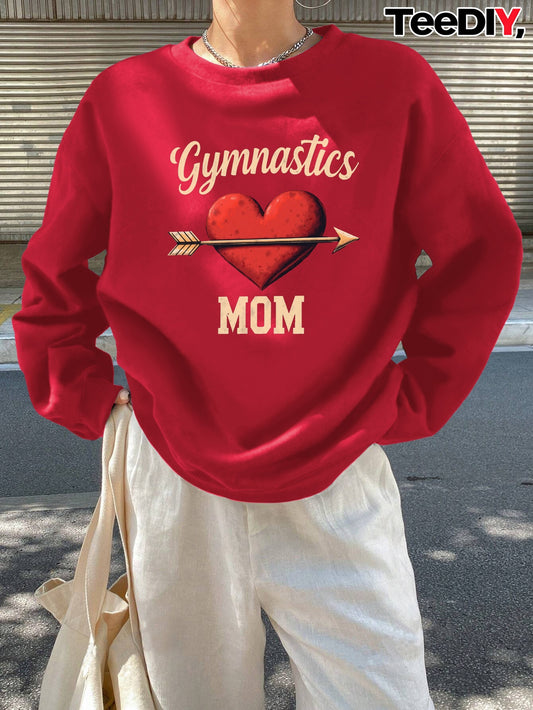 teediy Women'S Gymnastics Mom Heart Arrow Sweatshirt - Black with Golden Lettering, Long Sleeve Round Neck Casual Pullover for Fall/Winter, Cozy Cheerleading & Casual Attire, Gymnastics Gifts for Mom, Cheerleader Apparel, Dur